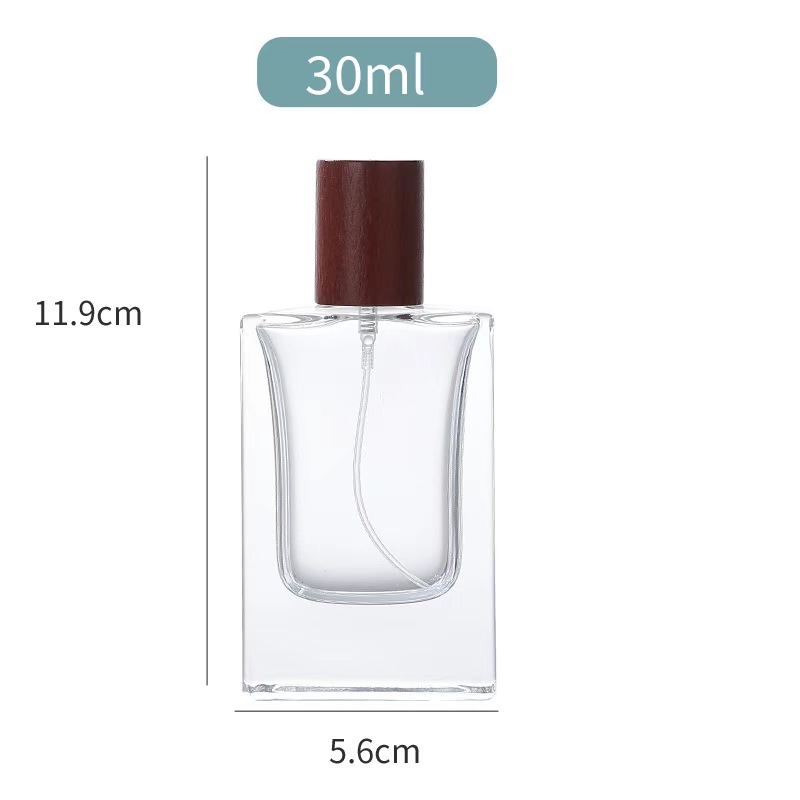 Botella de cristal del rociador de perfume 30ml con diverso casquillo de madera 